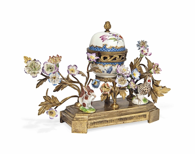A CONTINENTAL PORCELAIN GILT-METAL MOUNTED POT-POURRI VASE AND COVER
LATE 19TH CENTURY
Modelled as