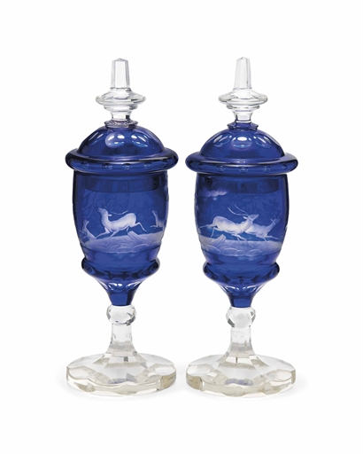 A PAIR OF BOHEMIAN CLEAR-FLASH BLUE OVERLAY GLASS GOBLETS AND COVERS
MID-19TH CENTURY
One engraved