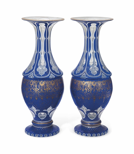 A PAIR OF BOHEMIAN CLEAR-FLASH WHITE AND BLUE OVERLAY CUT-GLASS VASES
LATE 19TH CENTURY
Made for the