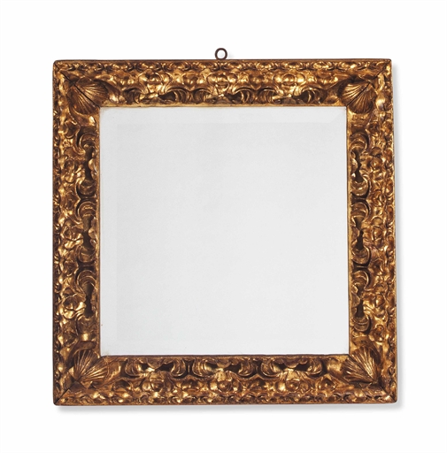 AN ITALIAN GILTWOOD PICTURE FRAME MIRROR
MID-18TH CENTURY, WITH A LATER PLATE
With deep C-scroll