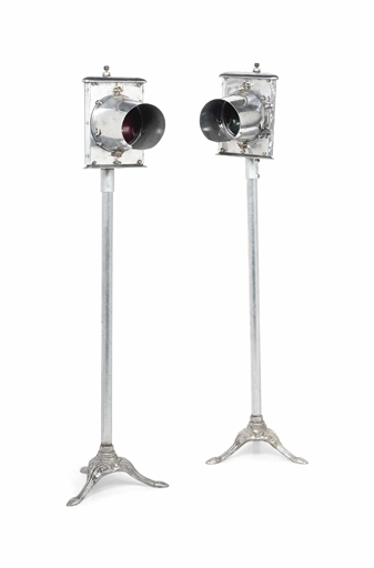 A PAIR OF ENGLISH ALUMINIUM TRAIN SIGNAL LAMPS
MID-20TH CENTURY
One with a green glass lense, the