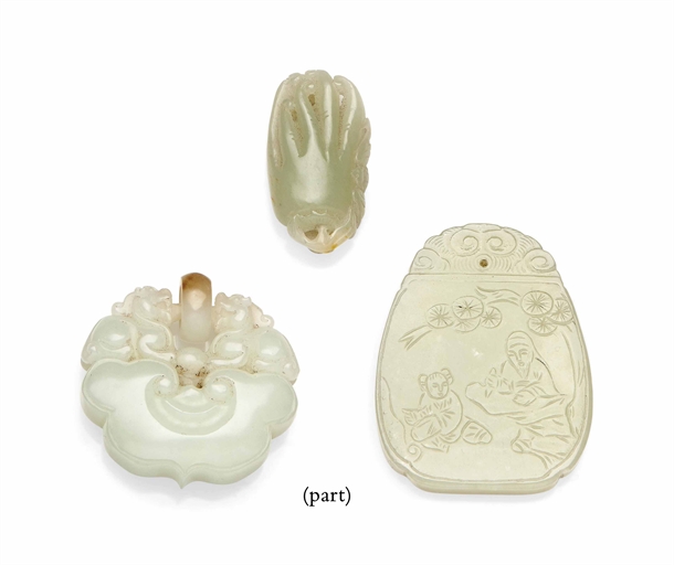 THREE CHINESE JADE PENDANTS
19TH/20TH CENTURY
The first, a plaque of rounded rectangular form carved