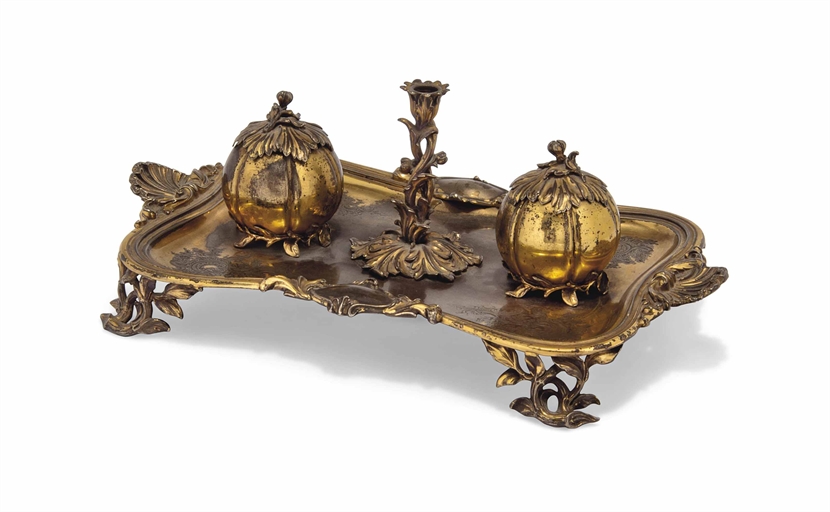 A VICTORIAN SILVER-GILT INKSTAND
MARK OF MESSRS. BARNARD, LONDON, 1840
Shaped oblong with shell