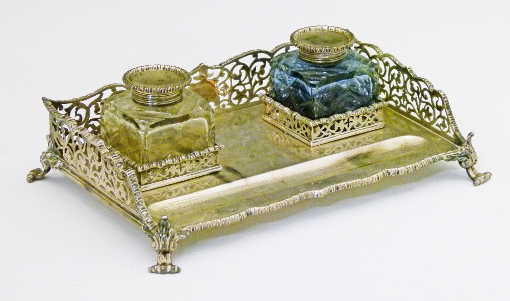 Victorian silver deskstand having a pierced gallery, two cut glass inkwells and standing on scroll