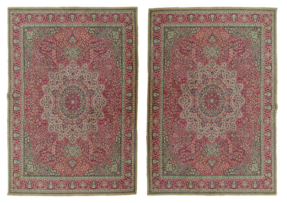 Pair of Wilton carpets decorated in the Persian style with a central medallion amongst tight