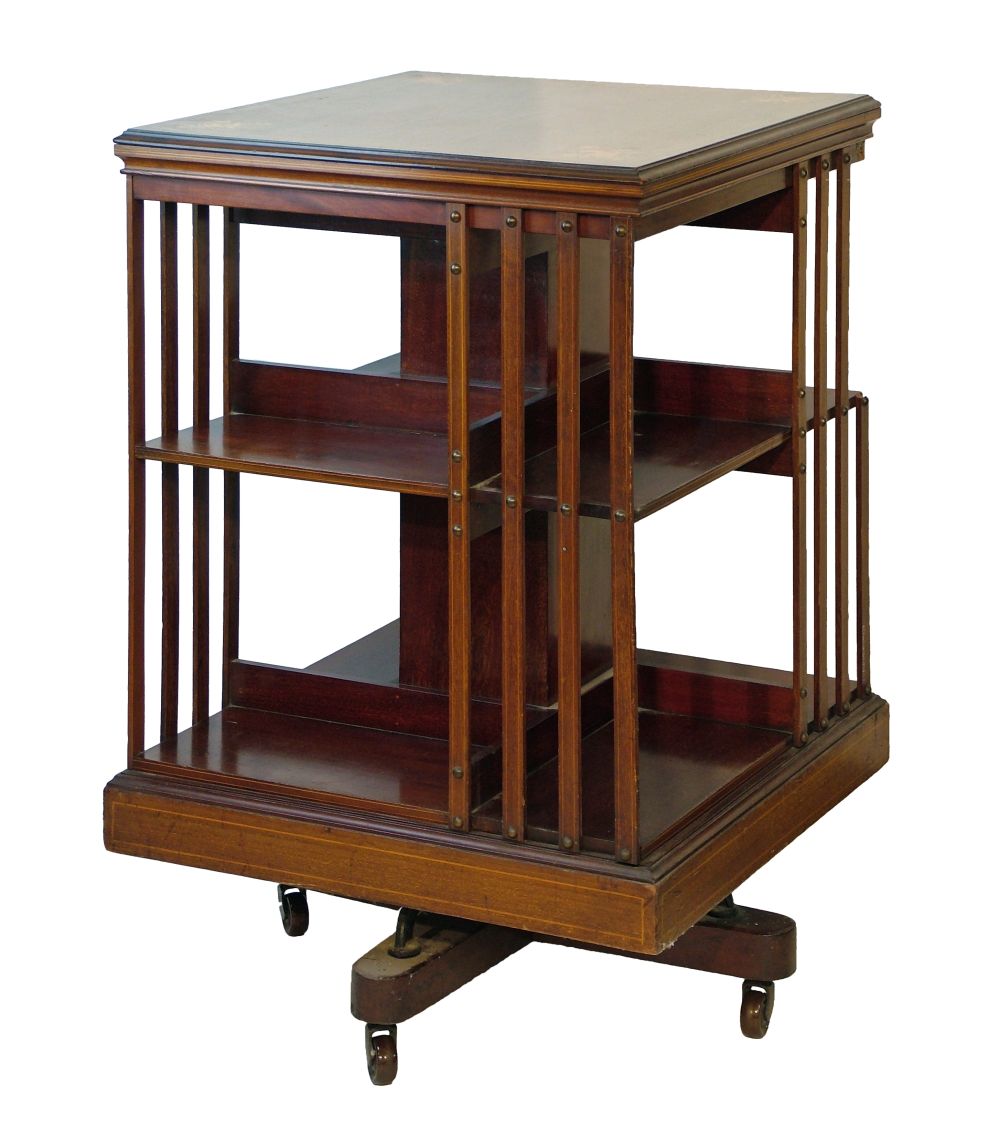 Edwardian mahogany square top revolving bookcase having inlaid decoration to the top depicting an