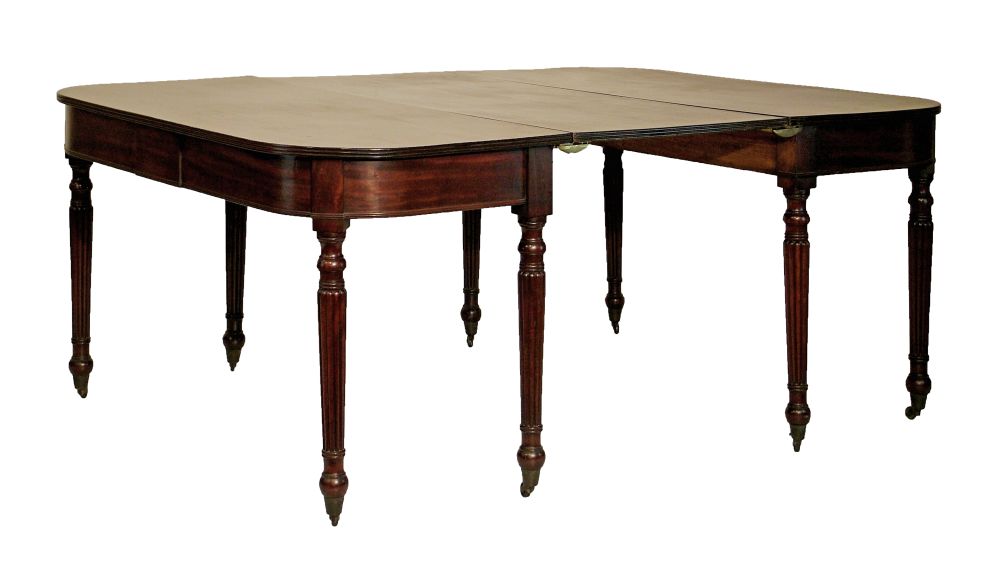 George IV mahogany extending dining table comprising: two `D` ends, each having a reeded edge and