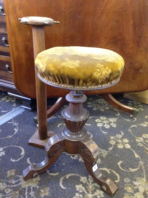 A 19th century revolving piano stool together with an ashtray stand.