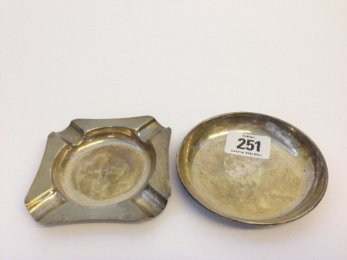 An engine turned silver ashtray together with a small circular silver pin tray (99.5 grams