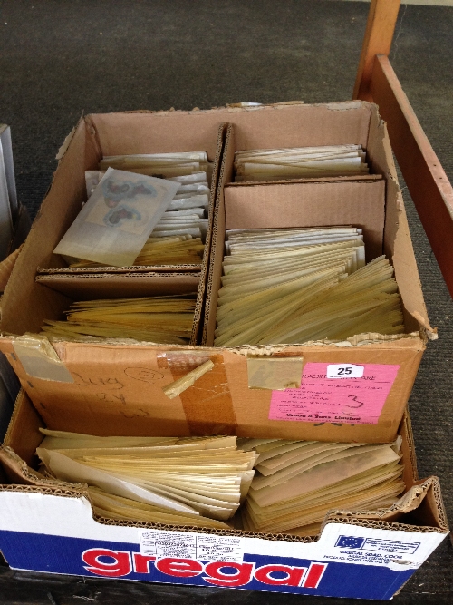 Two large boxes of stamps in collectors envelopes.