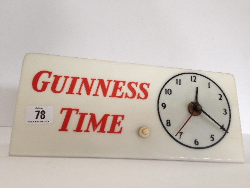 An early 20th century plastic bar top illuminated advertising clock: 'Guinesss time'.
