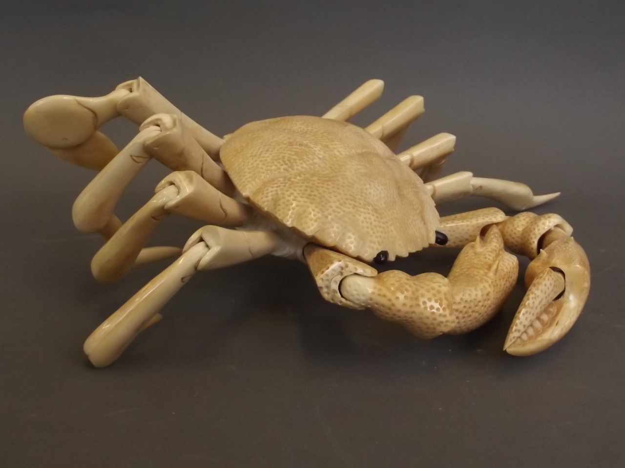 A Japanese carved bone articulated crab, 10" wide, 7" long folded