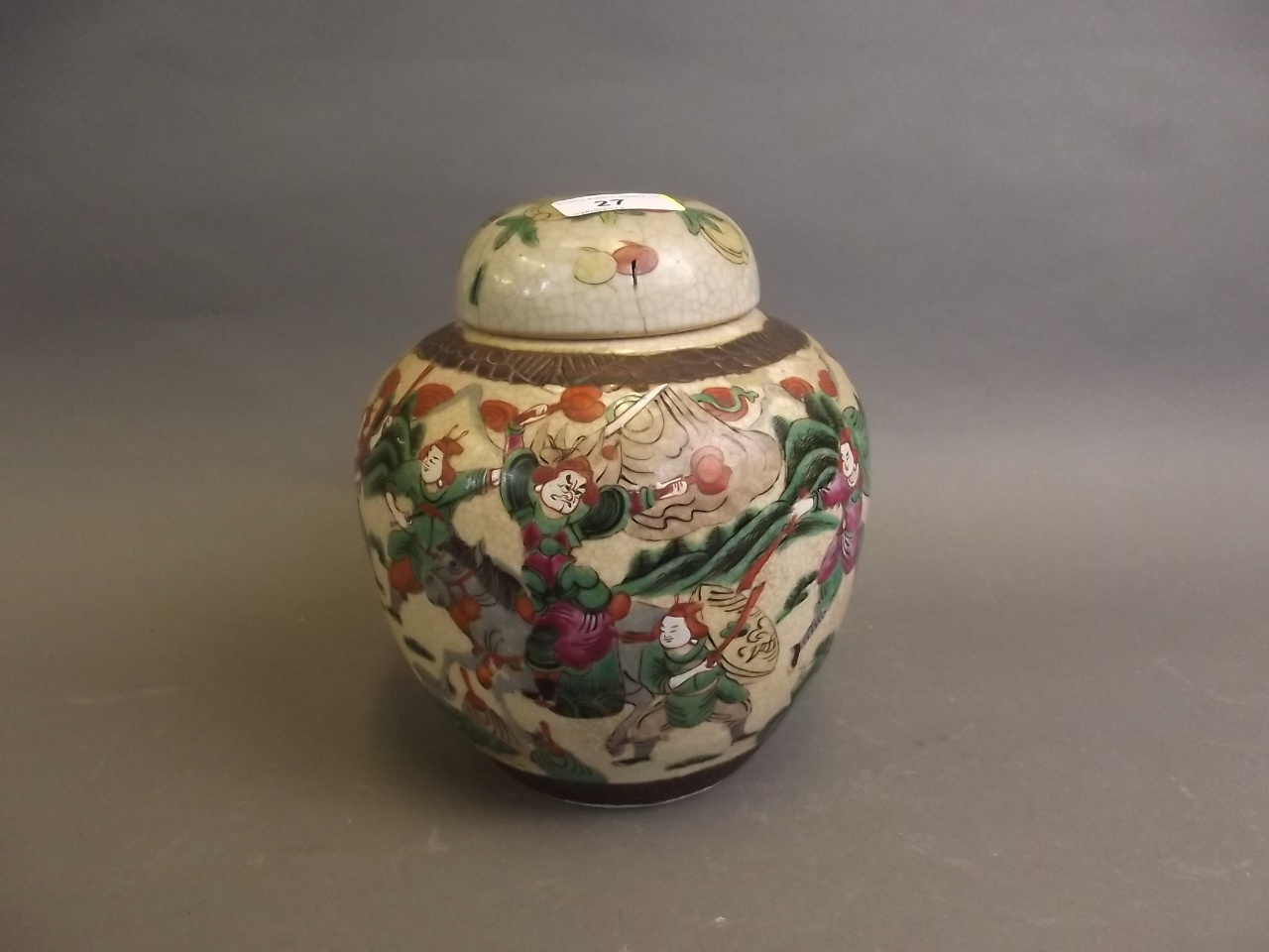 A C19th Chinese crackle glazed pottery ginger jar and cover decorated with warriors, 7½'' high