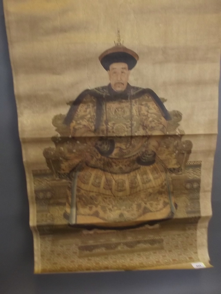 A Chinese scroll with overpainted print of a seated king, and another depicting a seated queen,