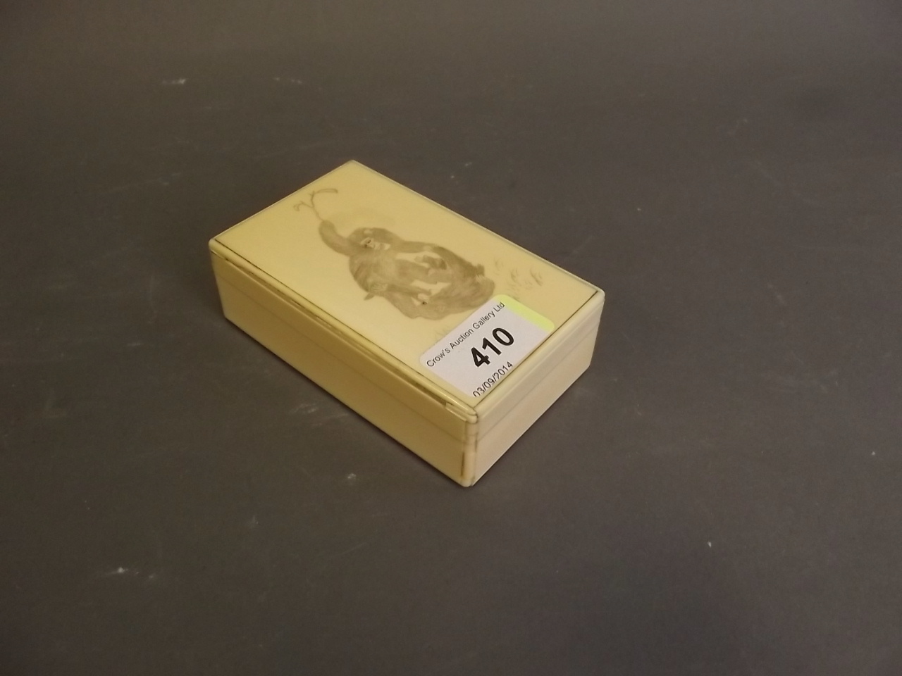 A C19th Japanese ivory rectangular box with etched decoration depicting a monkey, 4" x 2½"