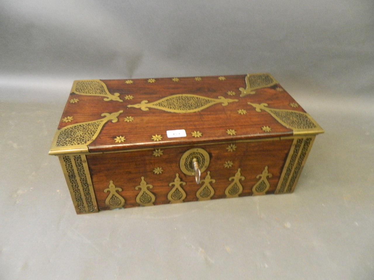 A superb early C19th Batavian hardwood casket with pierced brass mounted and inlaid decoration,