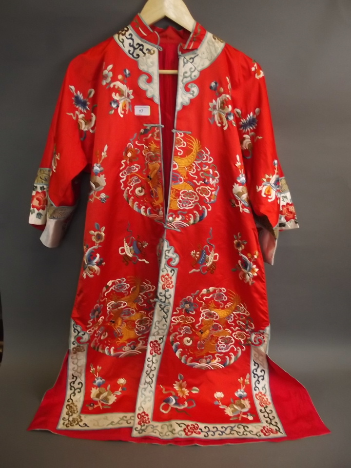 An early C20th Chinese silk embroidered kimono decorated with dragons, carp etc