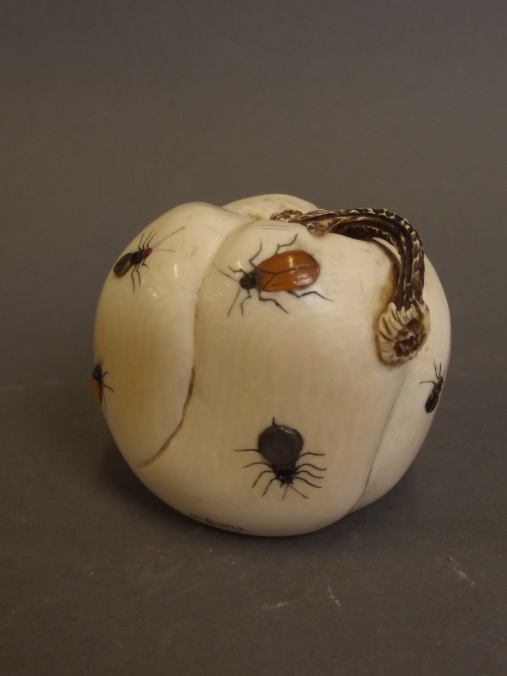 A carved ivory model of a gourd with shibiyama decoration, four character mark signature, 2" high