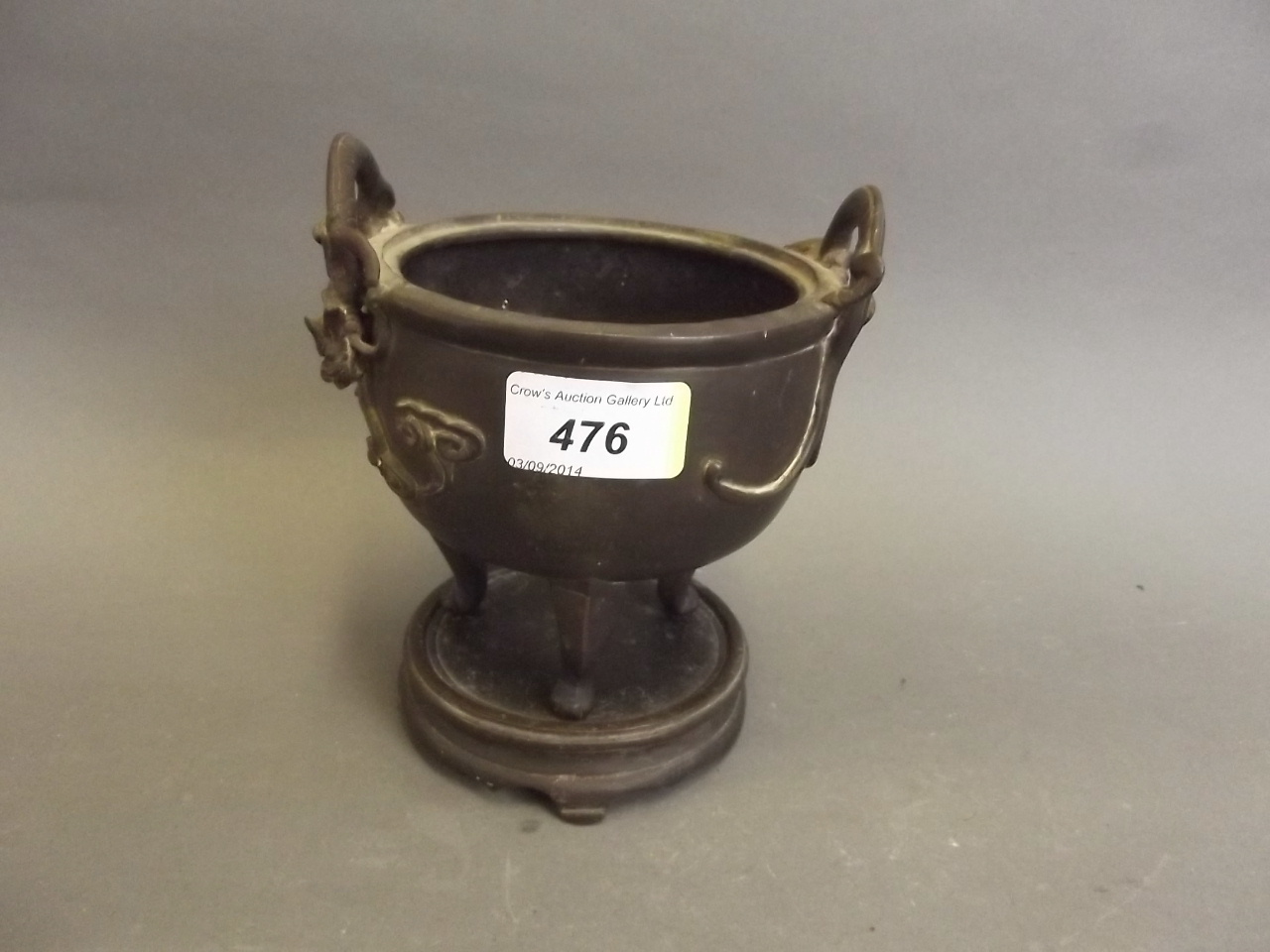 An early Chinese bronze censer with twin dragon handles on stand, impressed mark to base, 6½" high