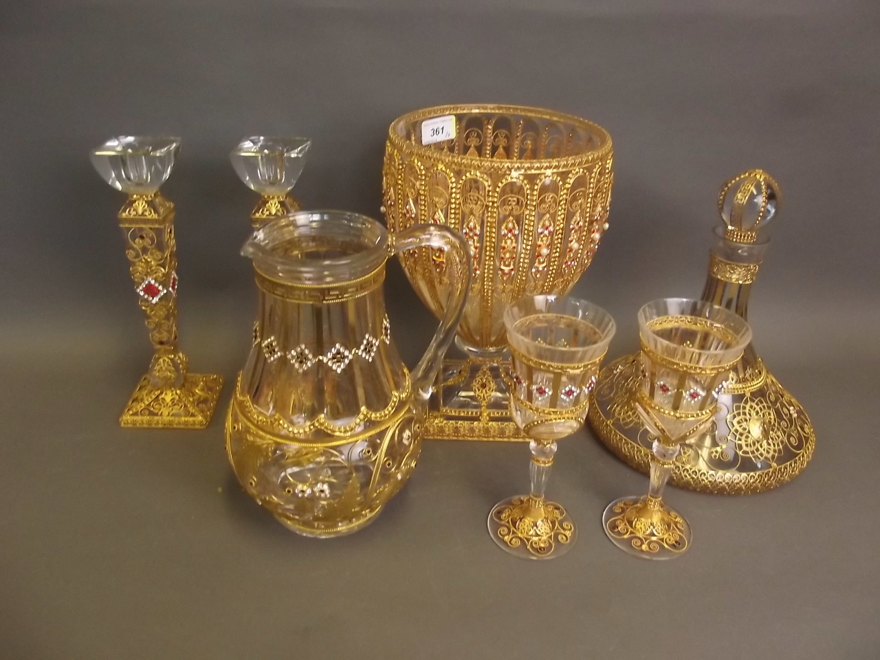 A superb suite of Isnik design silver gilt overlaid glassware, set with rubies and pearls, to
