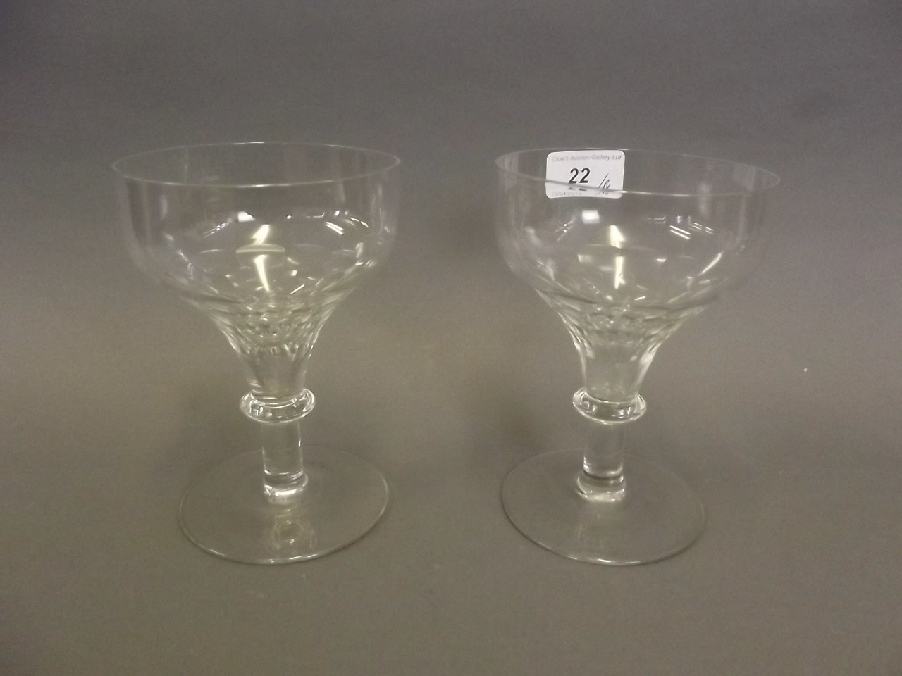 A pair of C19th faceted cut glass drinking glasses, 6'' high