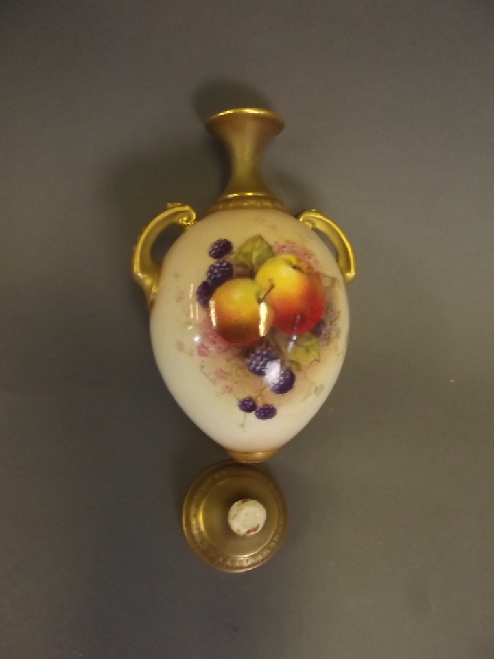 A Royal Worcester twin handled vase painted with fruit, signed, 6½'' high (AF)