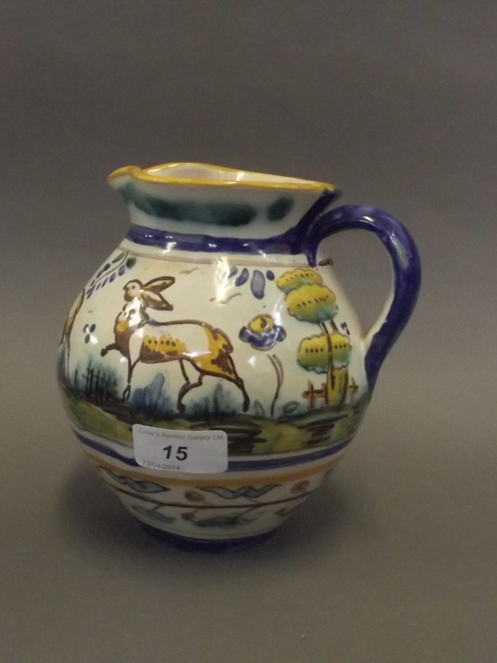 A Continental Majolica jug painted with deer, 6½'' high