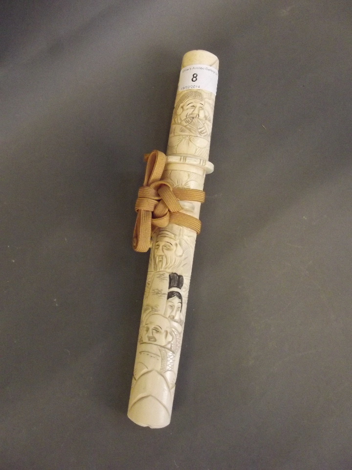A Japanese carved bone handled knife in a carved bone scabbard, 11½'' long