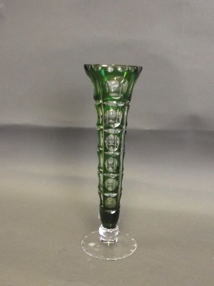 A green glass stem vase with geometric cut patterns to sides, 8½'' high