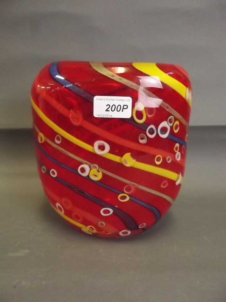 A Murano red ground vase with blue and yellow swirl decoration and millefiori bands, 8½'' high