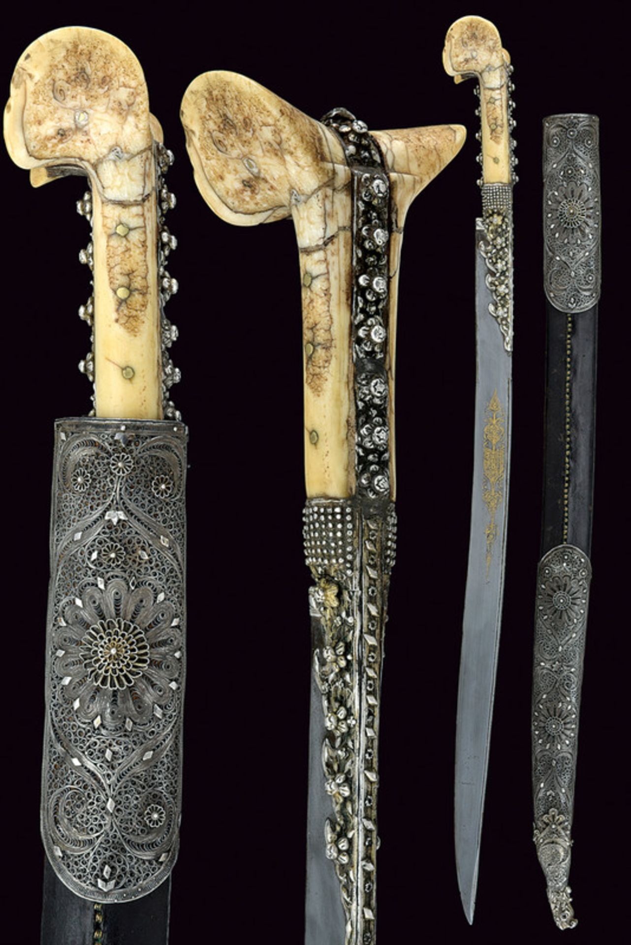 A filigree decorated yatagan dating: early 19th Century provenance: Turkey Slightly curved, single-