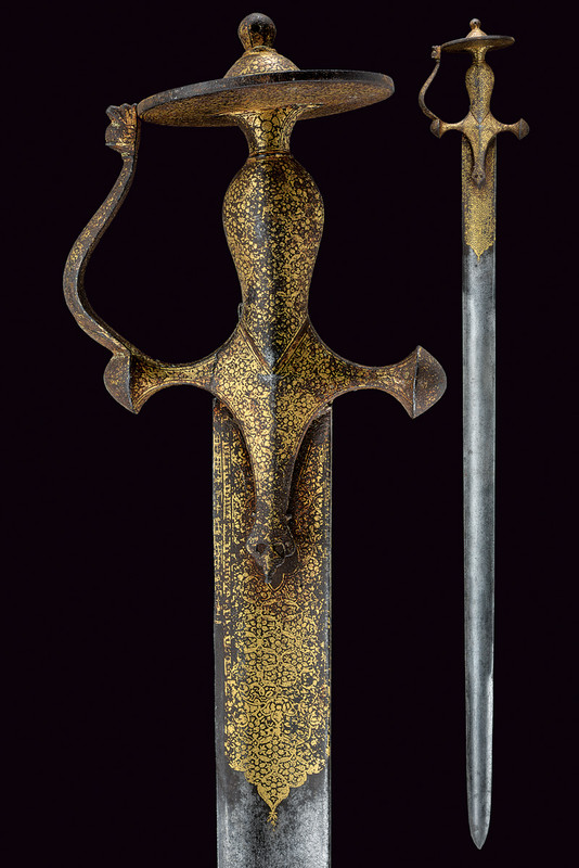 A khanda dating: 18th Century provenance: India Straight, single -tip and false-edged blade, wide