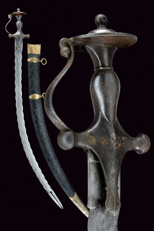 A tulwar with undulated blade dating: 19th Century provenance: India Curved, single-edged, undulated