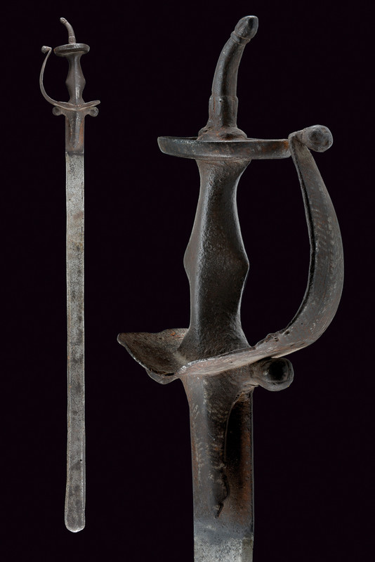 A khanda dating: 19th Century provenance: India Wide, straight, single -and false-edged blade with