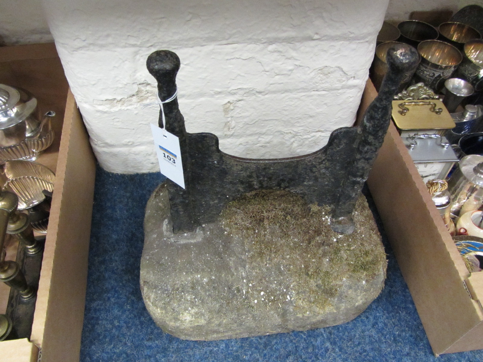 Victorian cast iron boot scraper on stone plinth