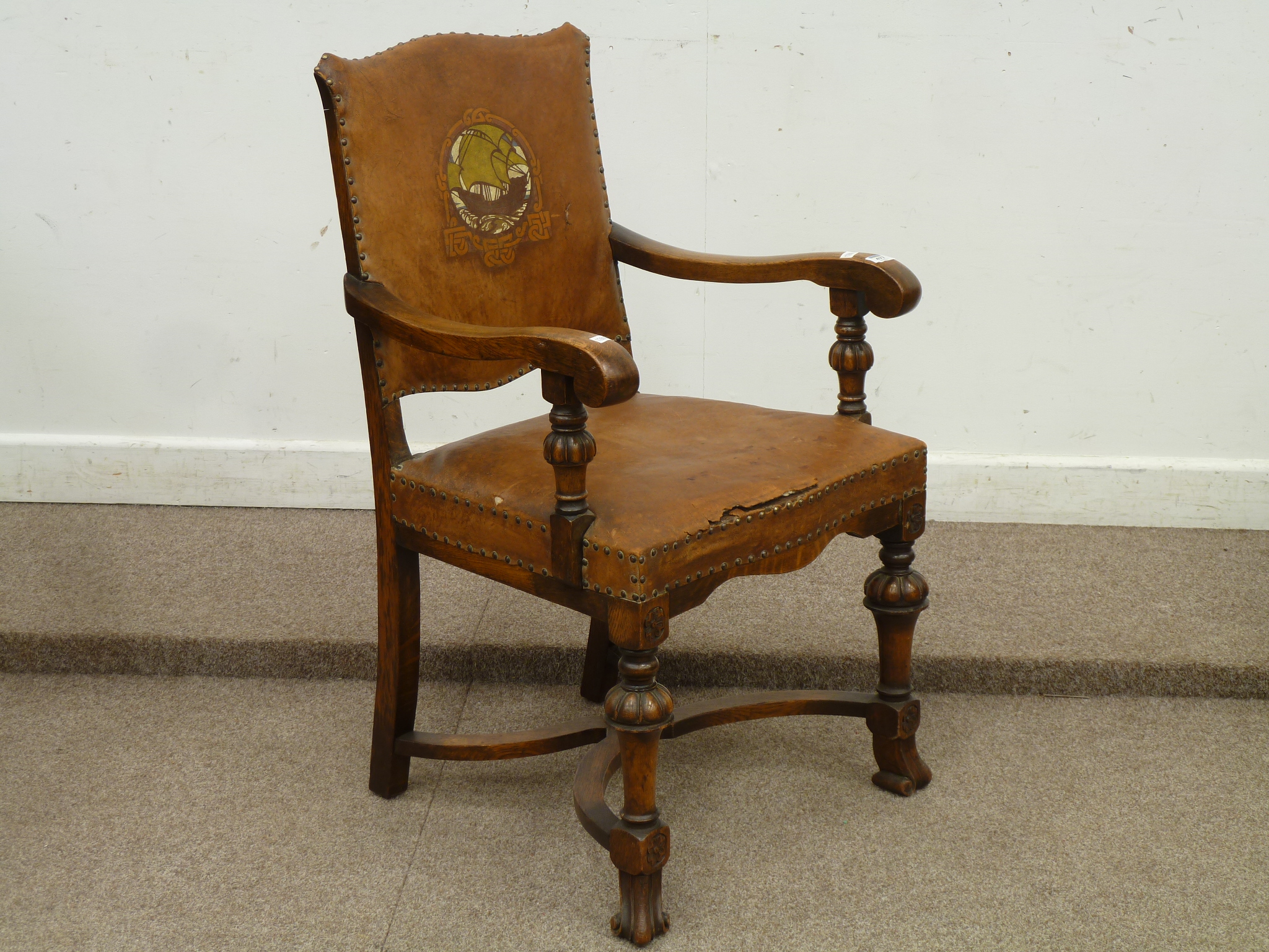 Early 20th century oak armchair with upholstered leather seat and back