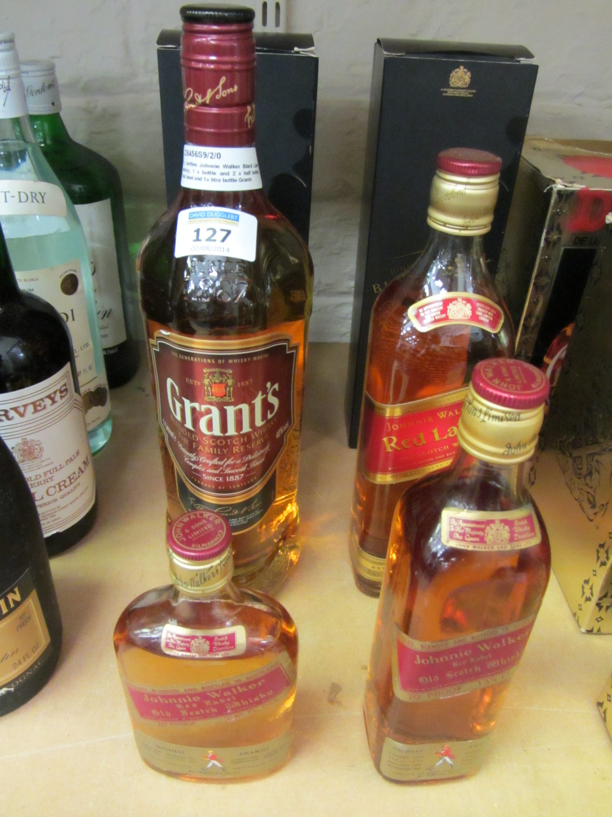 2 x bottles Johnnie Walker Black Label whisky, 1 x bottle and 2 x half bottles Red label and 1x