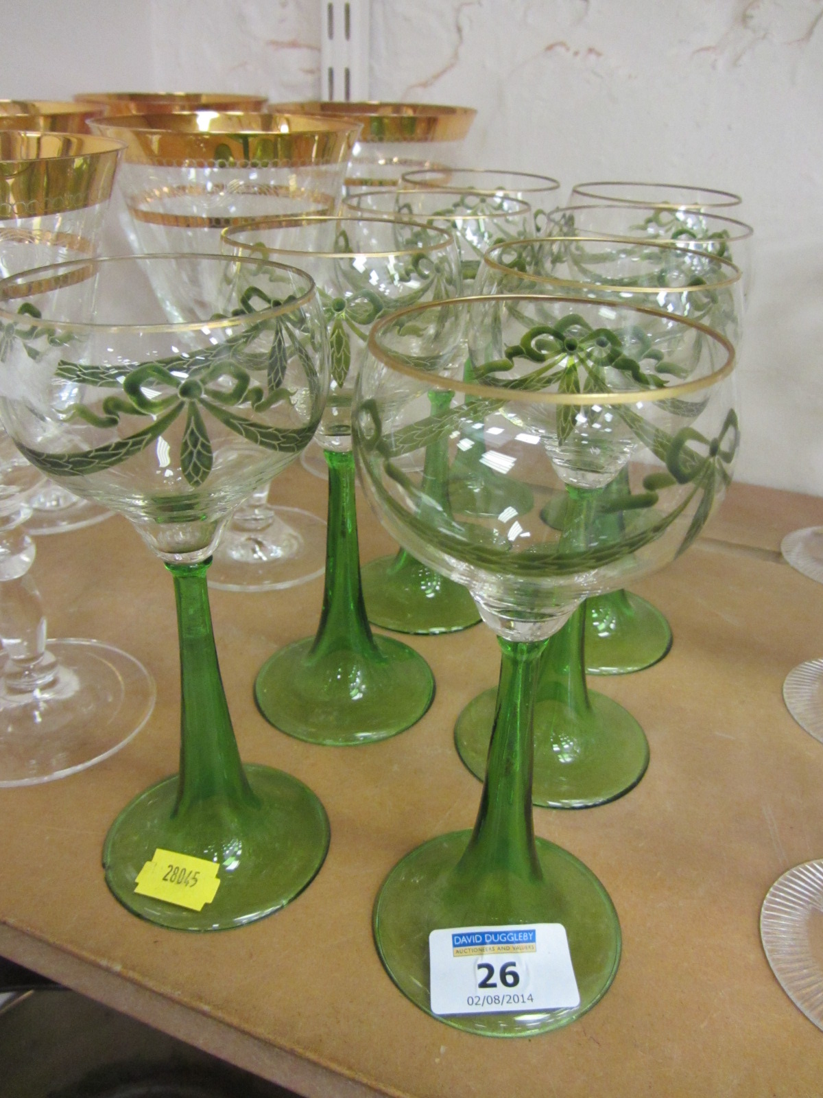 Set of eight early 20th century wines with green trumpet stems