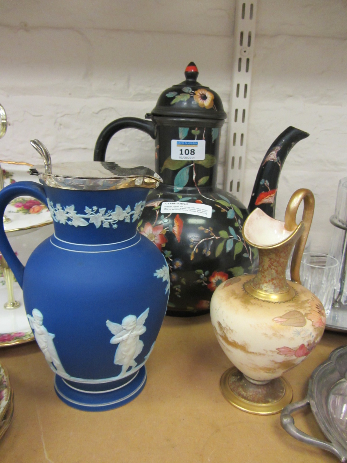 Victorian coffee pot painted with floral sprays against a black ground, Victorian blue jasper ware