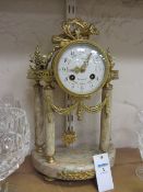 Mid 19th century French pink veined marble and gilt metal four pillar portico clock, striking