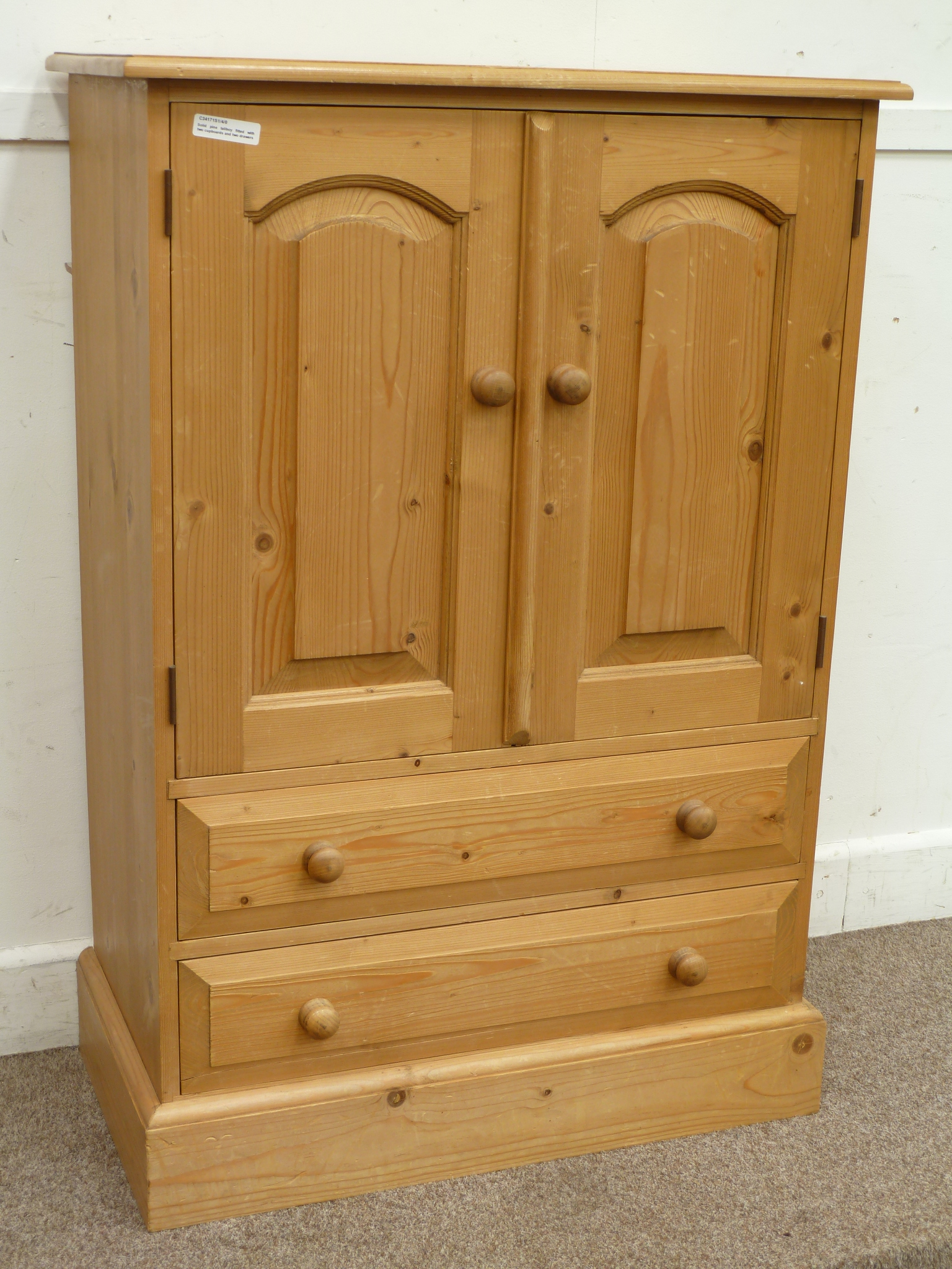 Solid pine tallboy fitted with two cupboards and two drawers, W71cm