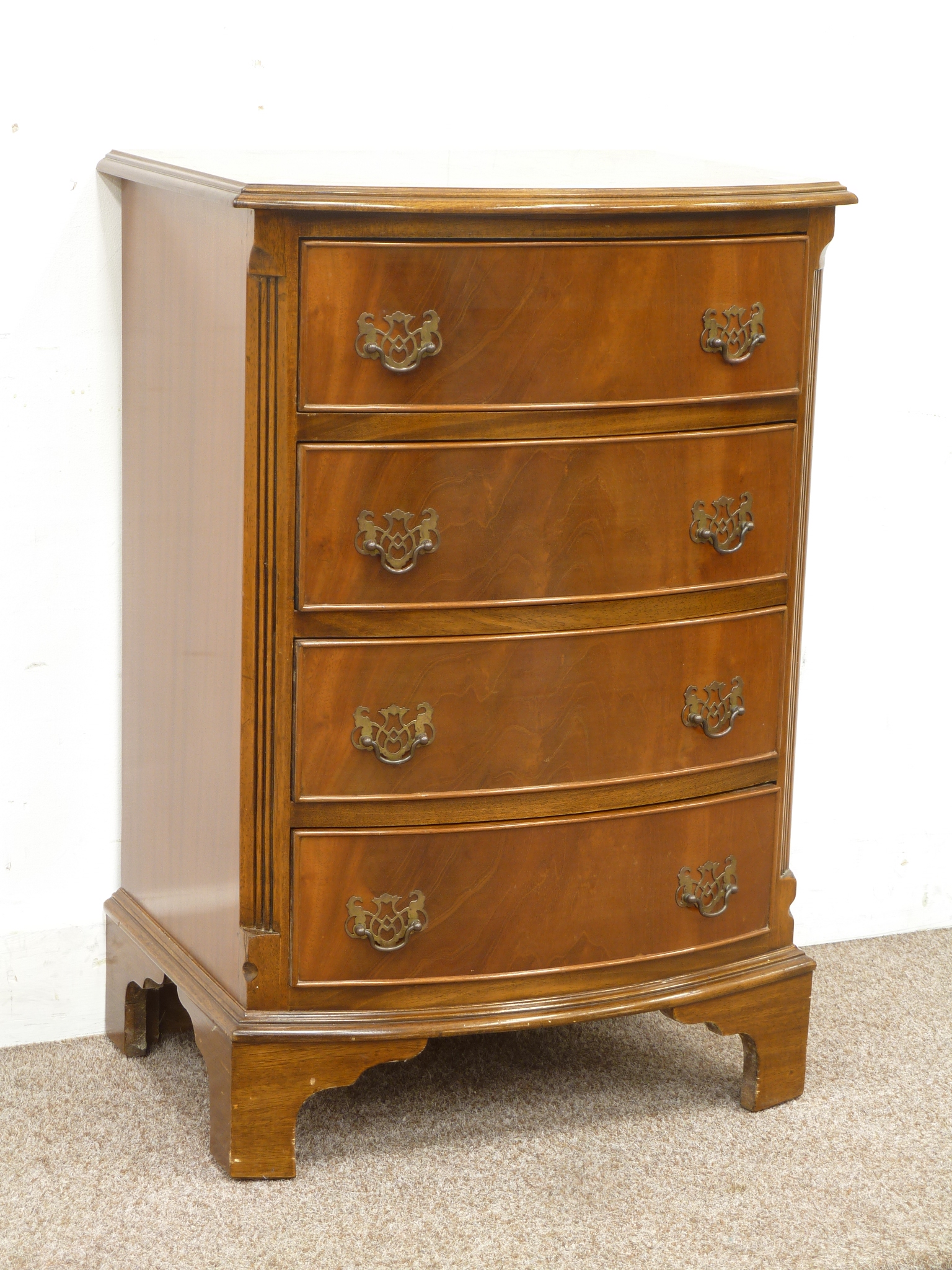 Reproduction mahogany bow front chest of four drawers with crossbanded top, W51cm