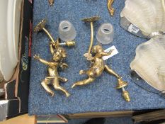 Pair 1940s French wall lamps with suspended cast brass cherubs and glass shades