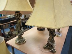 Two lamp bases in the form of gilded cherubs