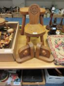 Oak kidney shaped stool and a child's chair with a carved Yorkshire rose motif, and a pair of oak