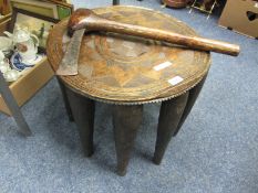 African carved hardwood ten legged table and an axe