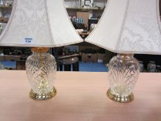 Pair of glass lamp bases with ivory damask shades