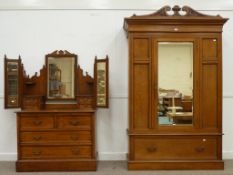 Edwardian golden oak wardrobe W139cm closed by single bevelled mirror door and matching dressing