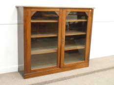 Edwardian walnut bookcase fitted with two glazed doors and adjustable shelves, W154cm x H130cm