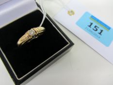 Diamond solitaire ring stamped 18k with woven shank